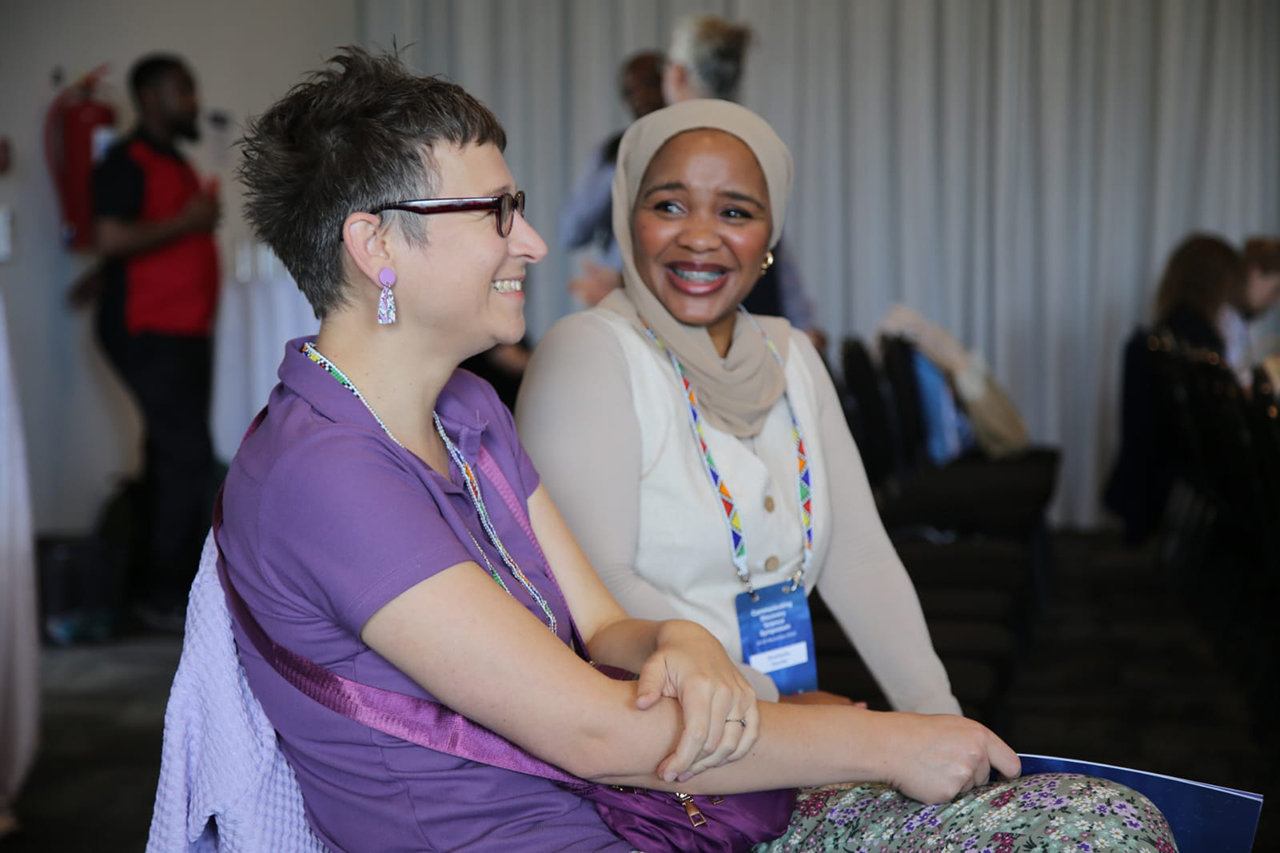 Delegates engaging and networking during the morning session of Day 1 at the Communicating Discovery Science Symposium, exchanging ideas and building connections in the early stages of the event.