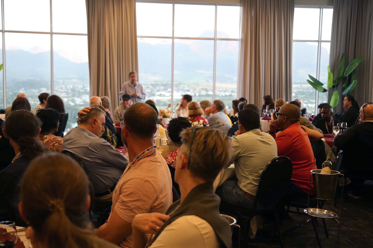 Enjoying a beautiful sunset view, Prof. Johann Mouton of CREST warmly welcomed everyone to the dinner.